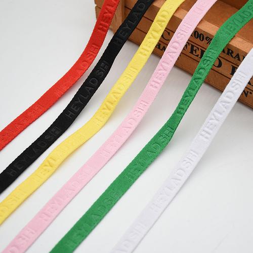 专业定制各种压字织带 厂家直销1cm涤纶压花弹力带服装辅料后领带